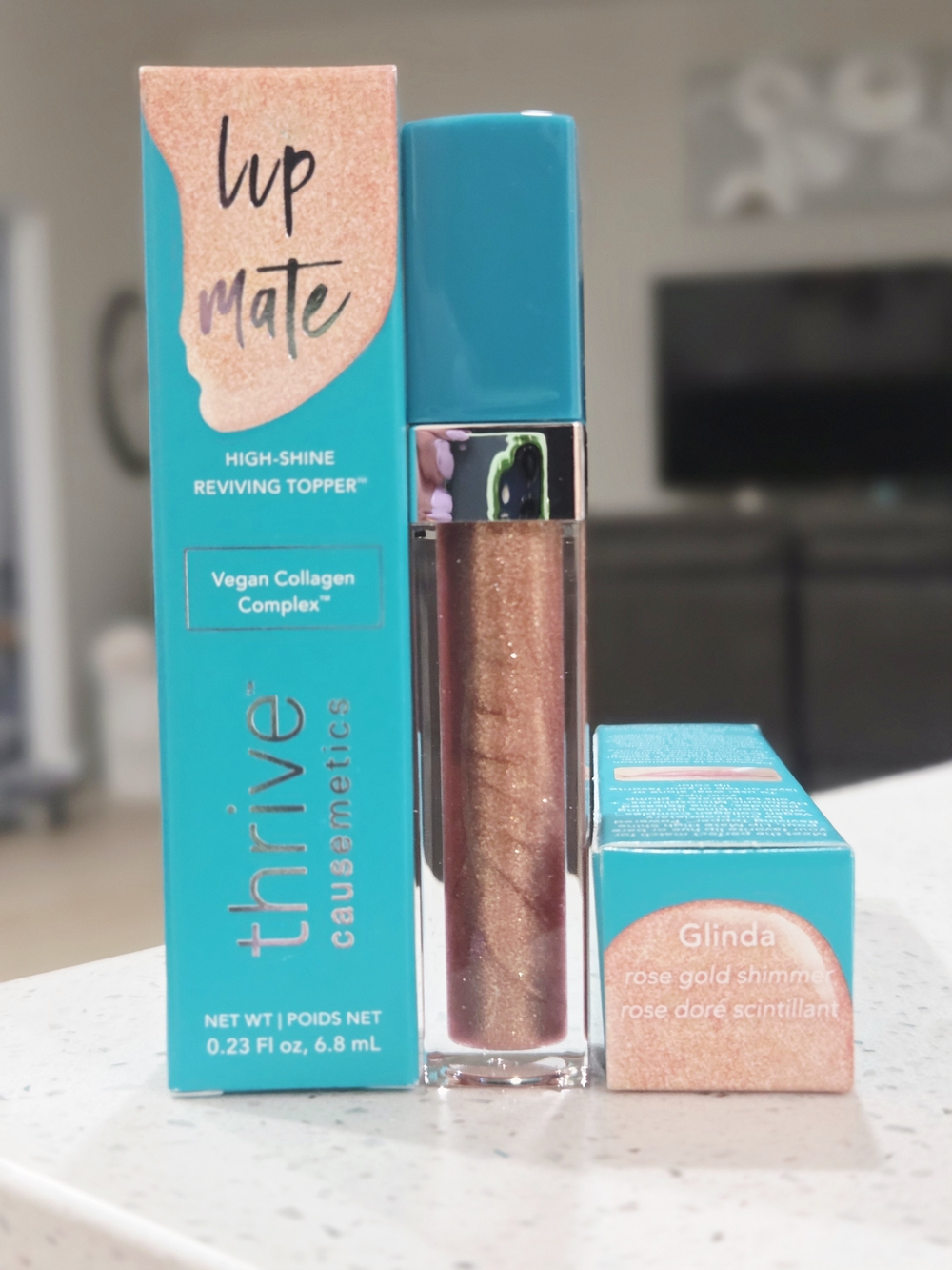 thrive causemetics Lip Mate High-Shine Topper in Glinda Rose Gold Shimmer